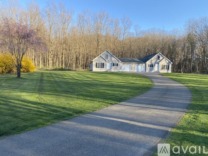 A house with a driveway in front of it.