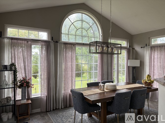 A bathroom with a glass shower stall and a bathtub.