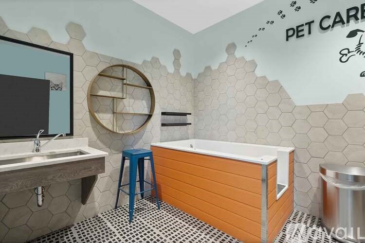 A bathroom with a wooden tub and a mirror.