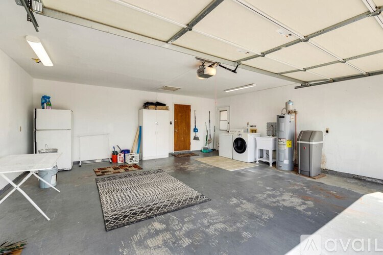 A large empty room with a white ceiling and a white floor.