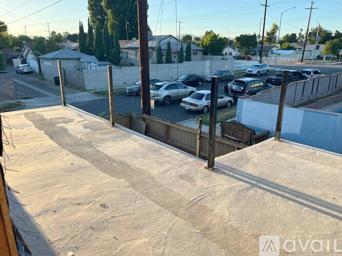 A parking lot with cars and a sign that says "available".