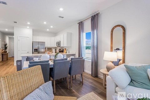 A floor plan of a house with a patio, family room, cafe, kitchen, powder room, entry, and 1-car garage.