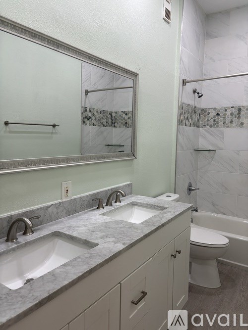 A dining room with a floral tablecloth and chairs.