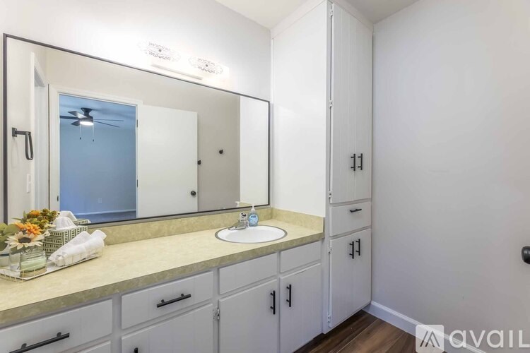 A piece of wood with a pink tag on it.