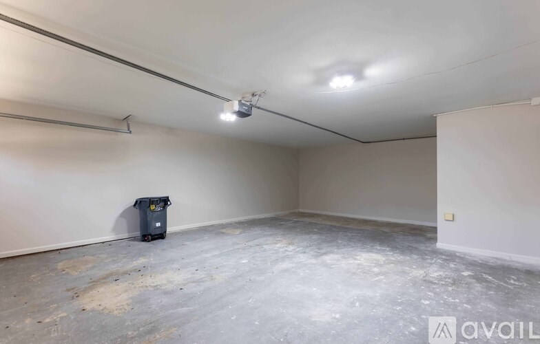 A room with a floor that is half painted and half unpainted.