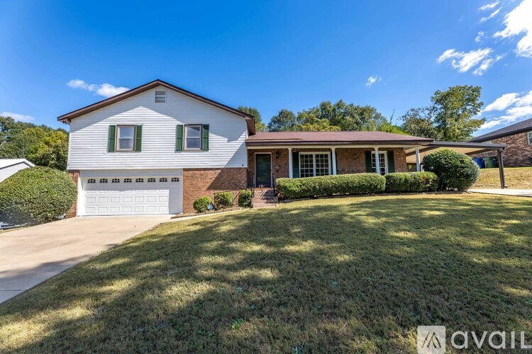 A house with a white garage door is for sale.