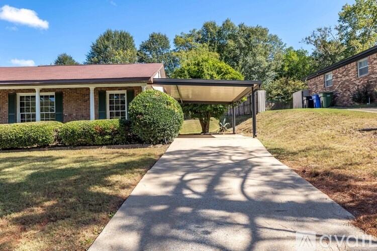 A house with a covered walkway leading to the front door.