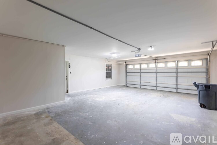 A room with a light fixture and a door.