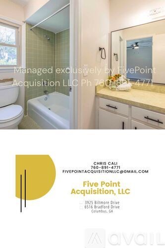 A spacious family room with a fireplace and wooden floors.