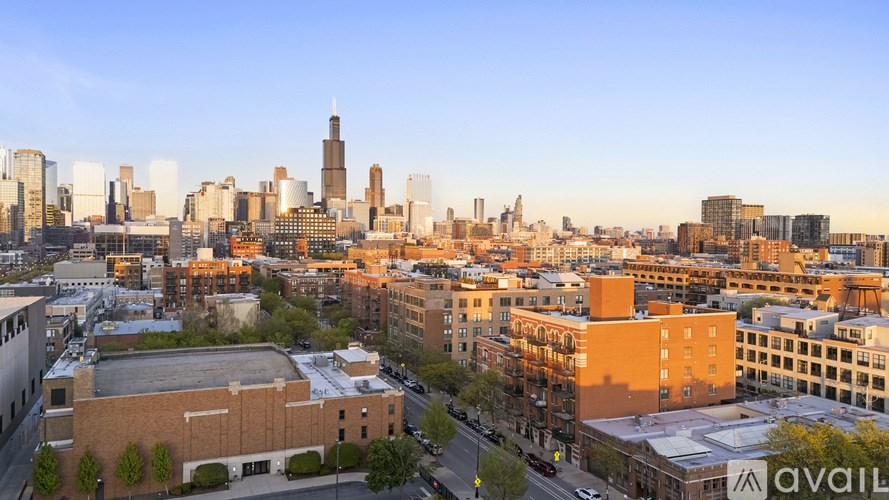 A cityscape with buildings of various heights and a clear sky.