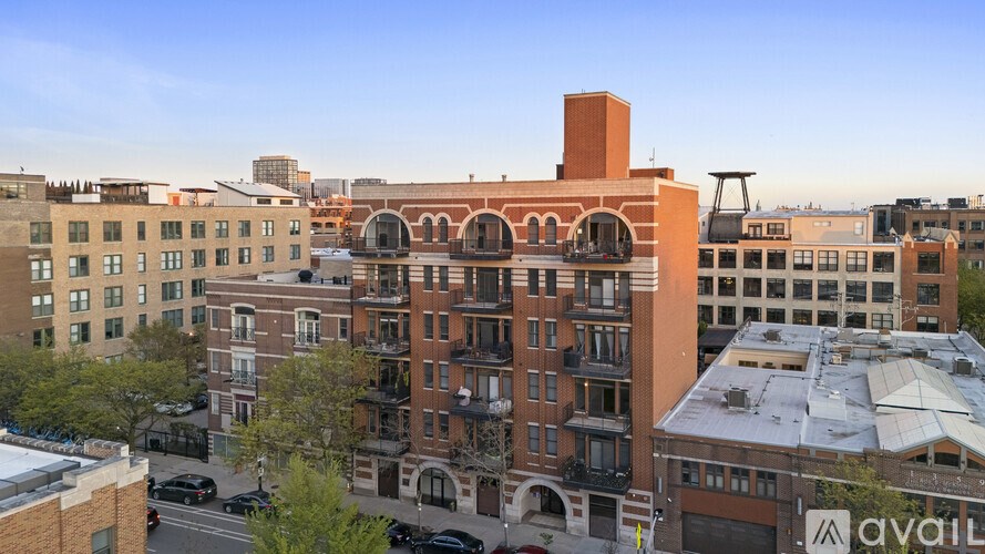 A view of a city street with buildings and cars.
