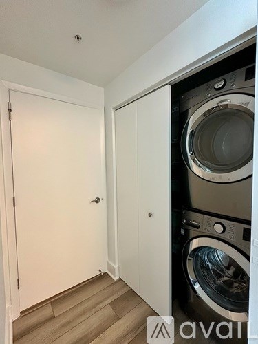 A stack of washing machines in a laundry room.
