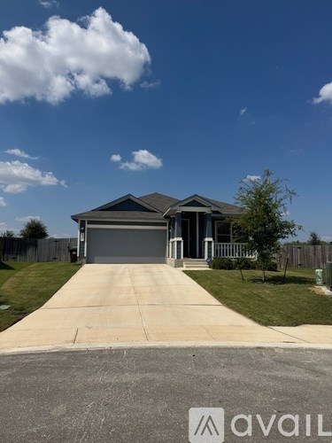 A house with a driveway in front of it.