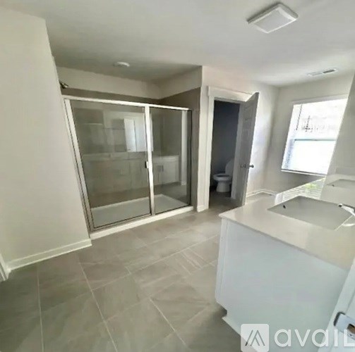 A kitchen with a white counter and a sink.