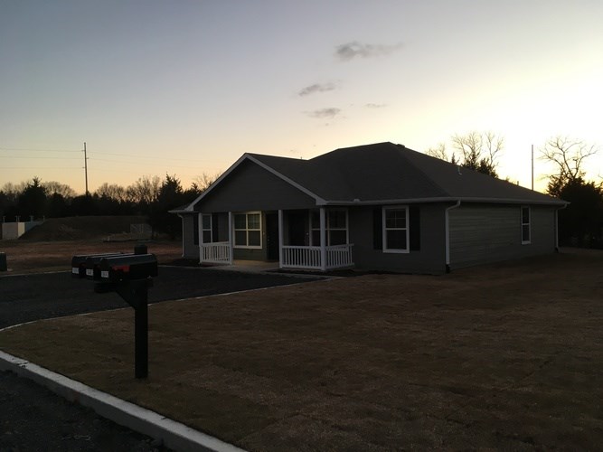 A house with a mailbox in front of it.