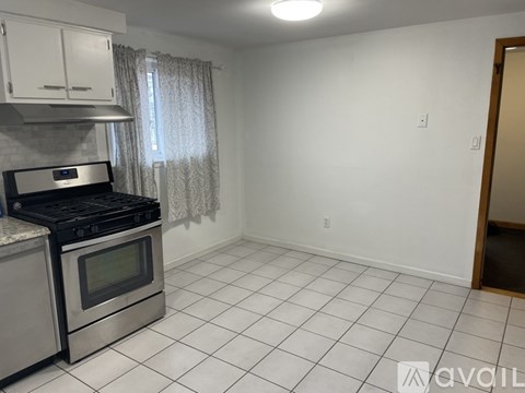 A kitchen with a stove top oven and a microwave.