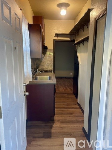 A kitchen with a sink and cabinets.