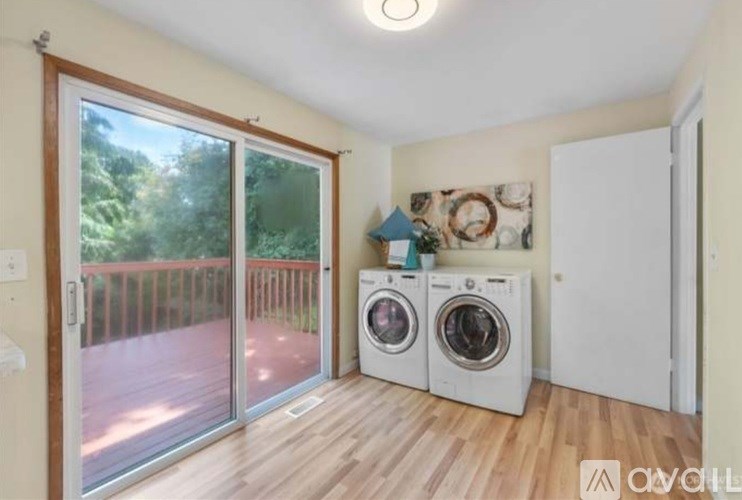 A room with a washer and dryer in it.