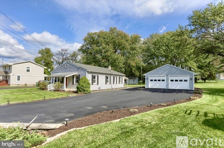 A residential area with a house and a garage.