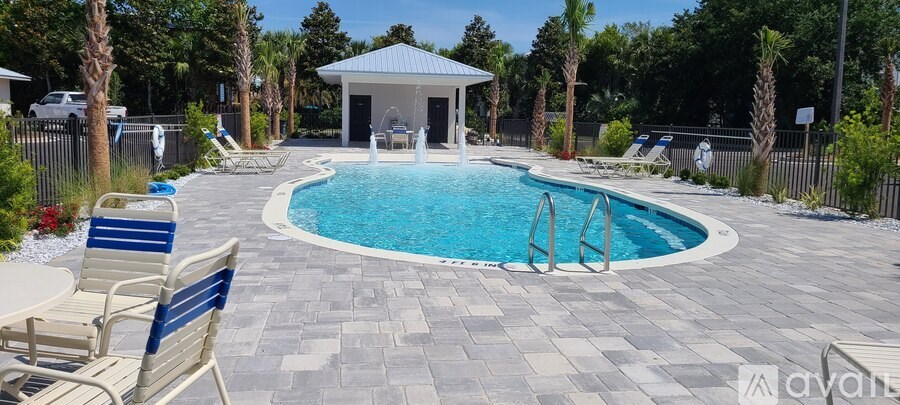 A pool with a gazebo in the middle of it.