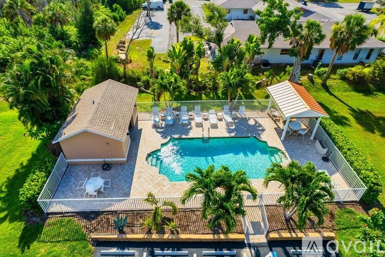 A large backyard with a pool and a deck.
