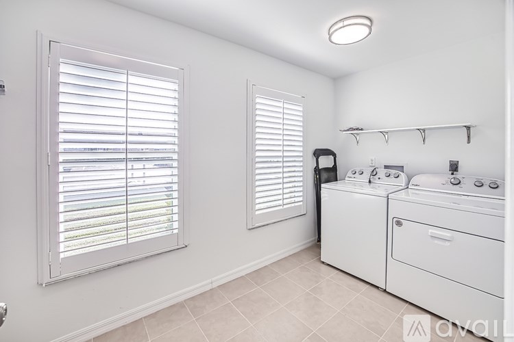 A laundry room with a washer and dryer.