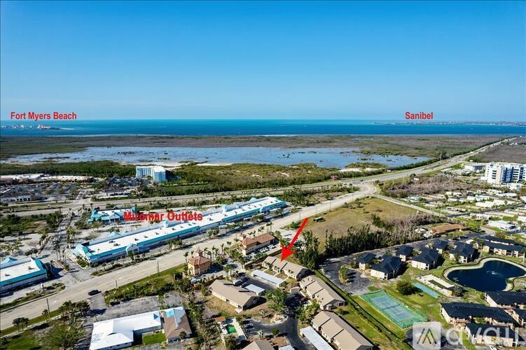 An aerial view of a beachfront area with a label pointing to a specific location.