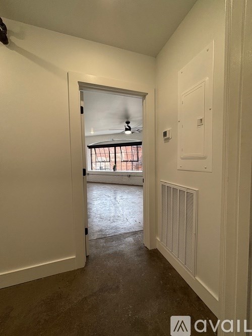 A room with a window and a door.