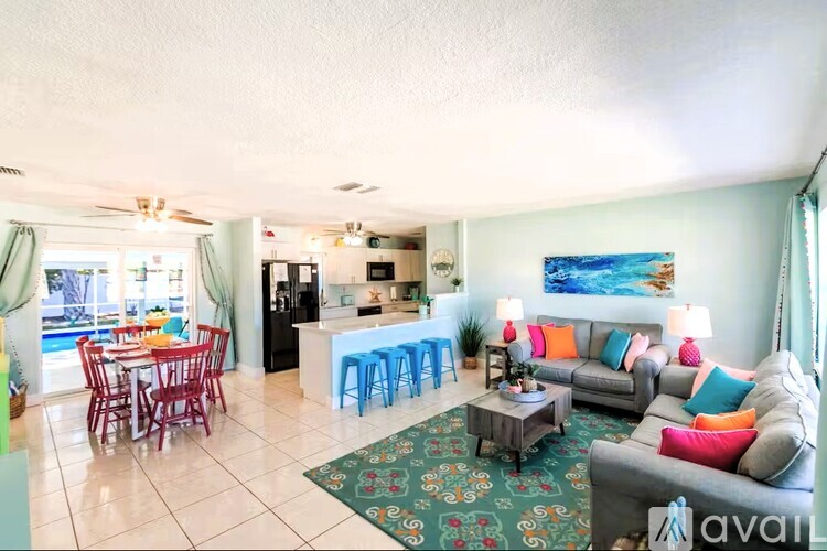 A living room with a grey couch and a coffee table.
