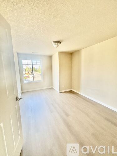 A room with a door and a window.