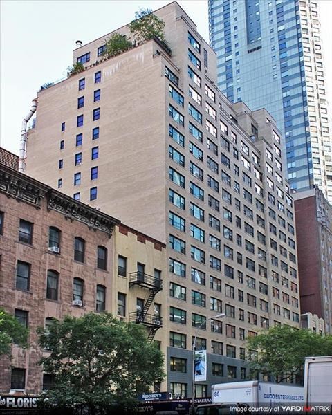 a tall building in the middle of a city