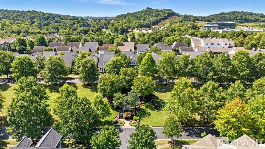 A suburban neighborhood with houses and trees.