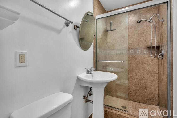 A kitchen with a microwave, oven, and fan.