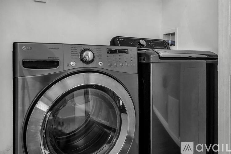 A bathroom with a tiled shower and a toilet.