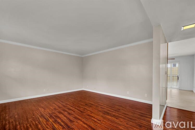 A kitchen with wooden cabinets and granite countertops.