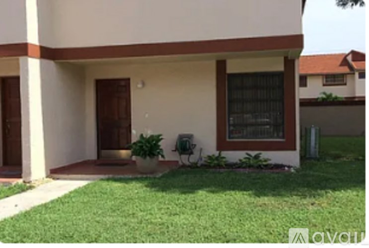 A house with a brown door and a window.
