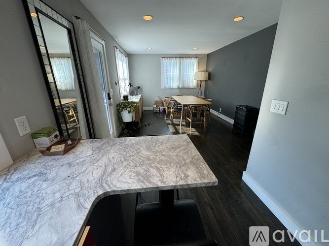 A dining room with a large table and chairs is shown.