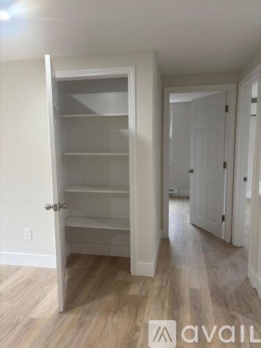 A white pantry with an open door and a logo that says "avail" on the bottom right.