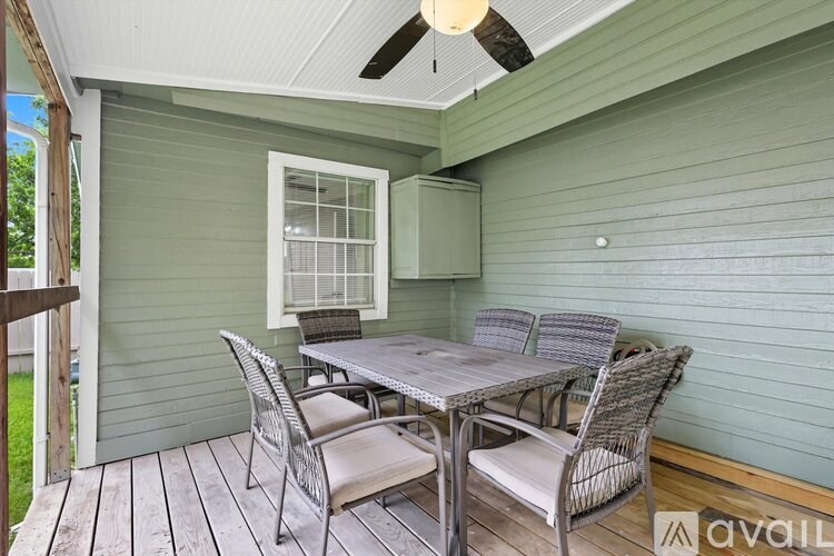 A patio with a table and chairs is available for rent.