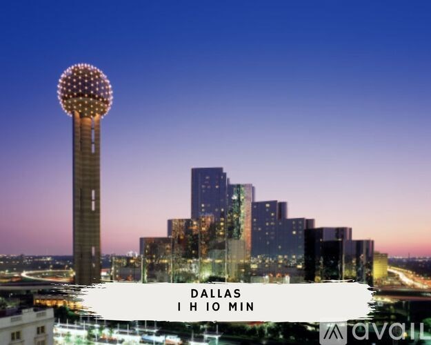Dallas skyline at night with Avail sign in foreground.