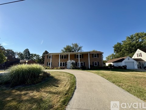 A house with a driveway in front of it.