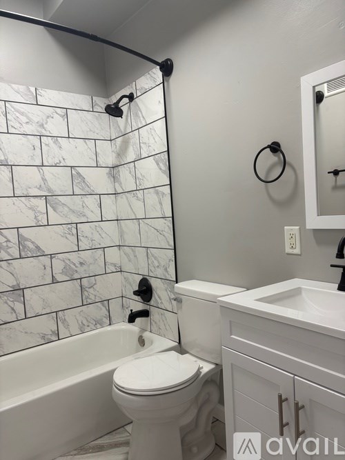 Empty refrigerator with shelves and a light on.