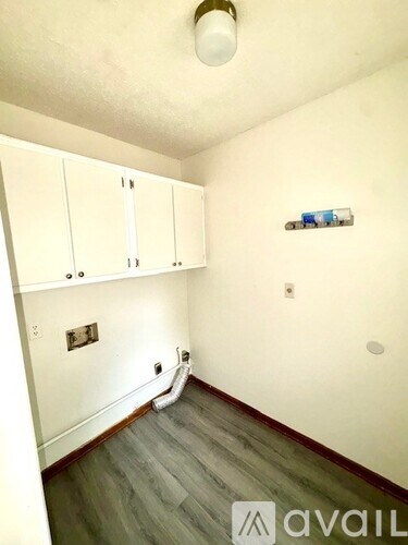 A room with white cabinets and a white ceiling.