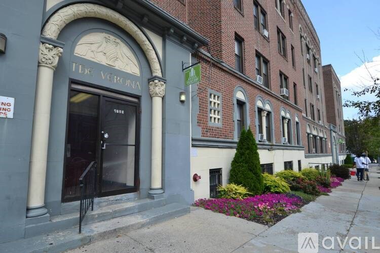 A street view of a building with a sign that reads "The Verona".