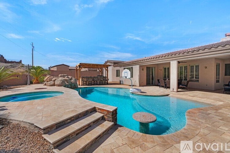 A house with a pool in the backyard.