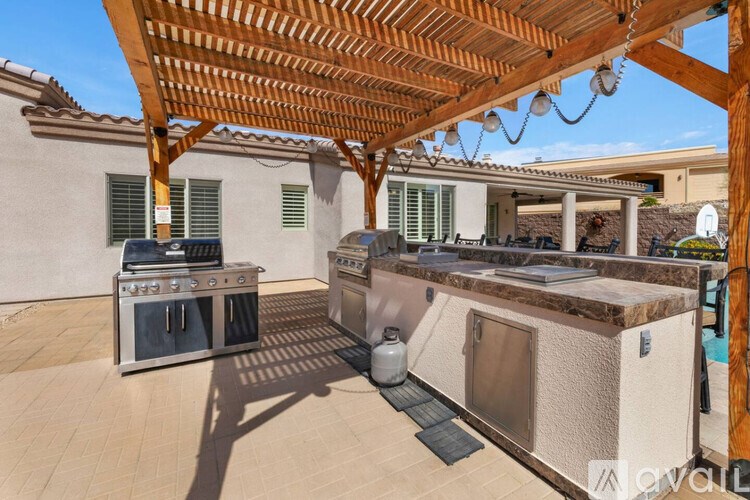 A patio with a grill and a barbecue area.
