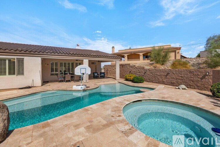 A house with a pool in the backyard.