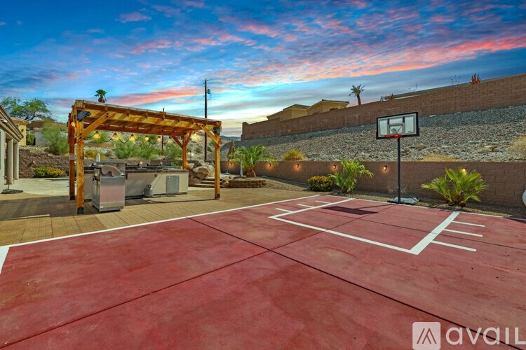 A basketball court with a hoop and a basketball net.