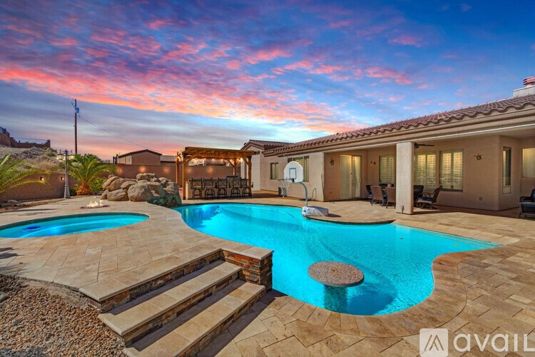 A house with a pool in the backyard.