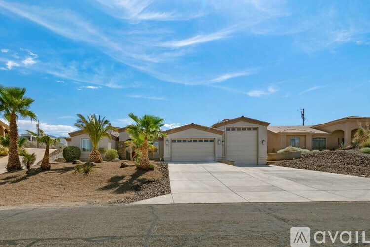 A row of houses with driveways in front of them.